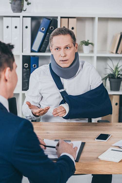 Disabled man wearing a neck brace arguing with a government representative over disability benefits