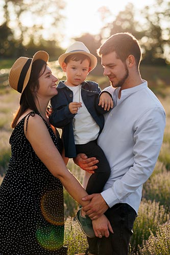 Young couple with their son enjoying time outside
