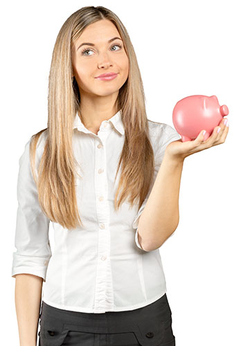 Woman holding up a piggy bank