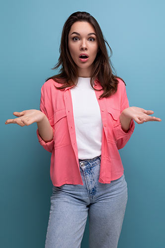 Woman shrugging because she doesn’t know the answer to the question, ‘Can you borrow from term life insurance?’
