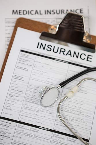 Disability insurance claim form on a clipboard