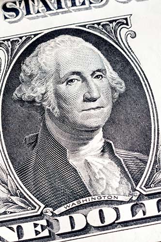 Close-up on George Washington’s portrait on the $1 bill, representing the payout from a short term disability insurance policy