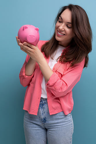 Woman holding a piggy bank