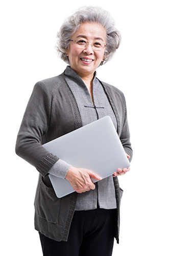 Happy senior woman holding a laptop