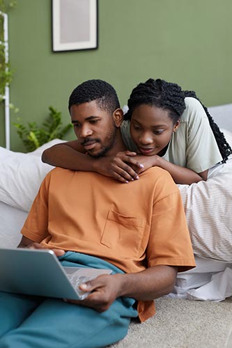 Young couple getting life insurance quotes online
